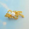 Picture of CZ Modern Bow Brooch Gold Plated with White Pearl
