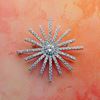 Picture of Shining Sun Brooch Rhodium Plated
