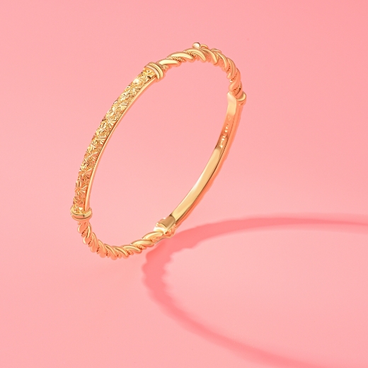 gold plated criss cross bangle