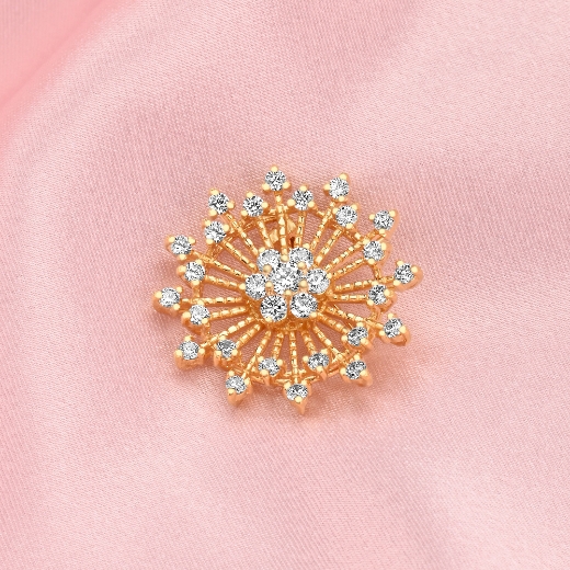 small sunburst gold plated brooch